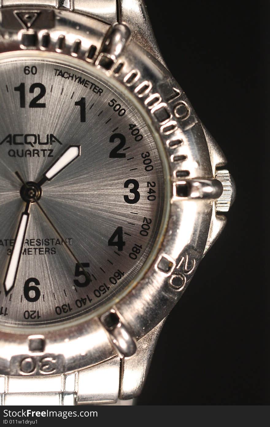 Closeup photo of half of the face of a  wristwatch.