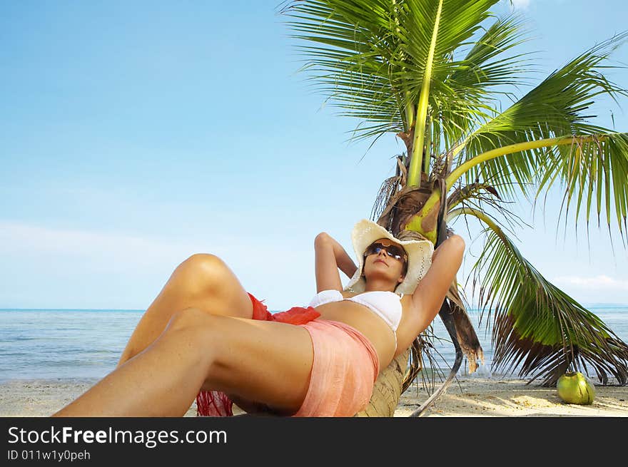 View of nice woman having fun on tropical beach. View of nice woman having fun on tropical beach