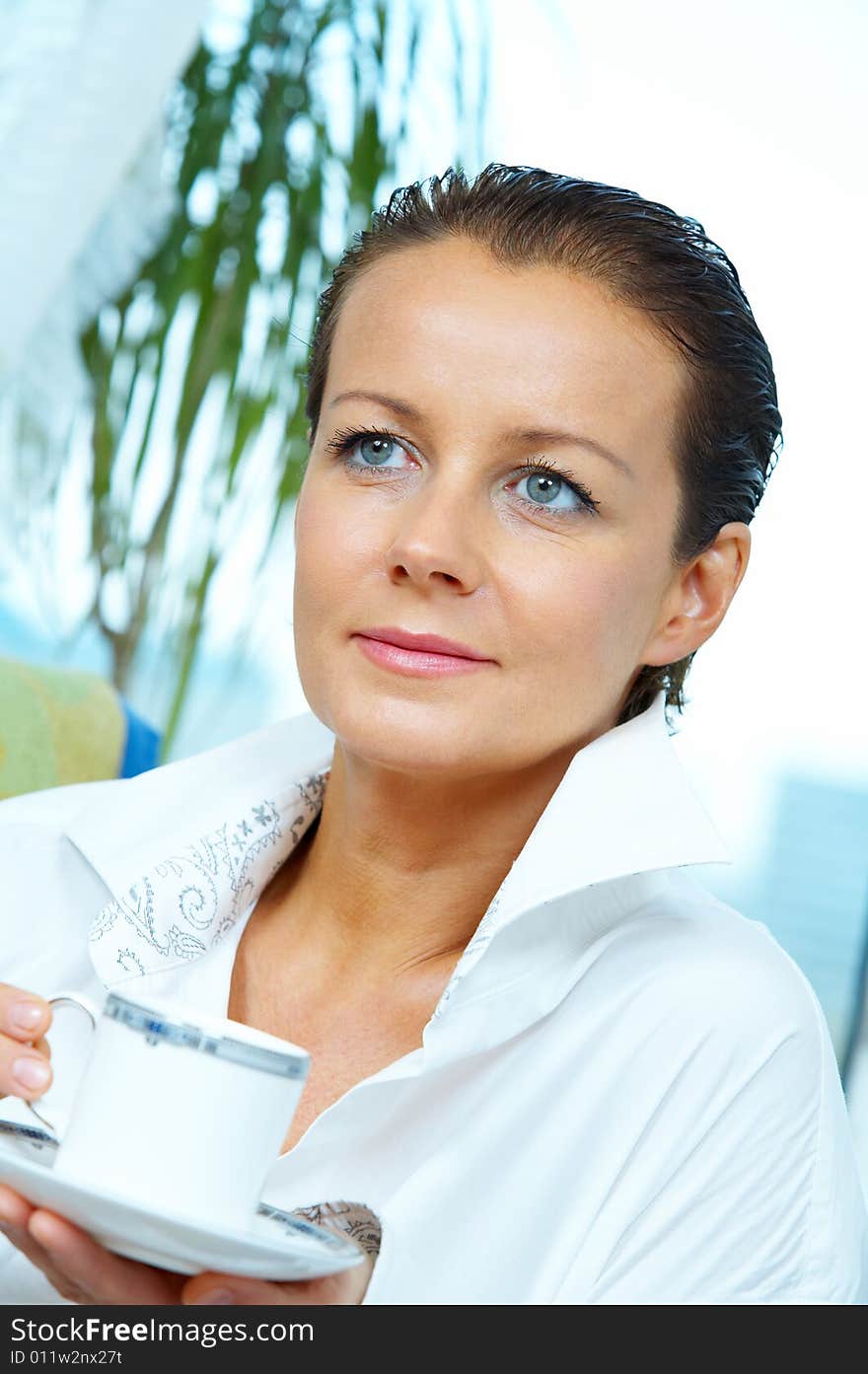 High key portrait of nice gorgeous woman drinking coffee. High key portrait of nice gorgeous woman drinking coffee