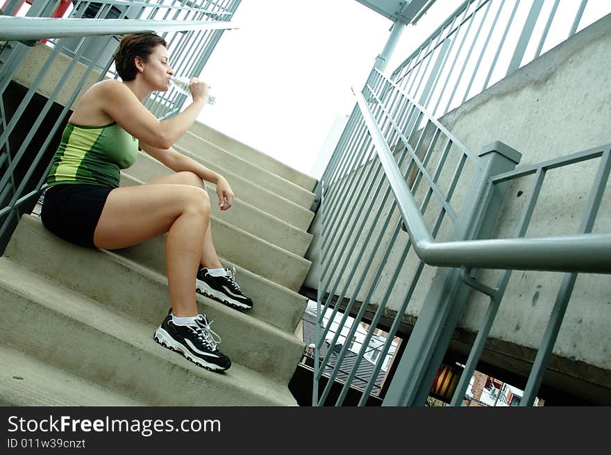 Mature woman runner in the city. Mature woman runner in the city.