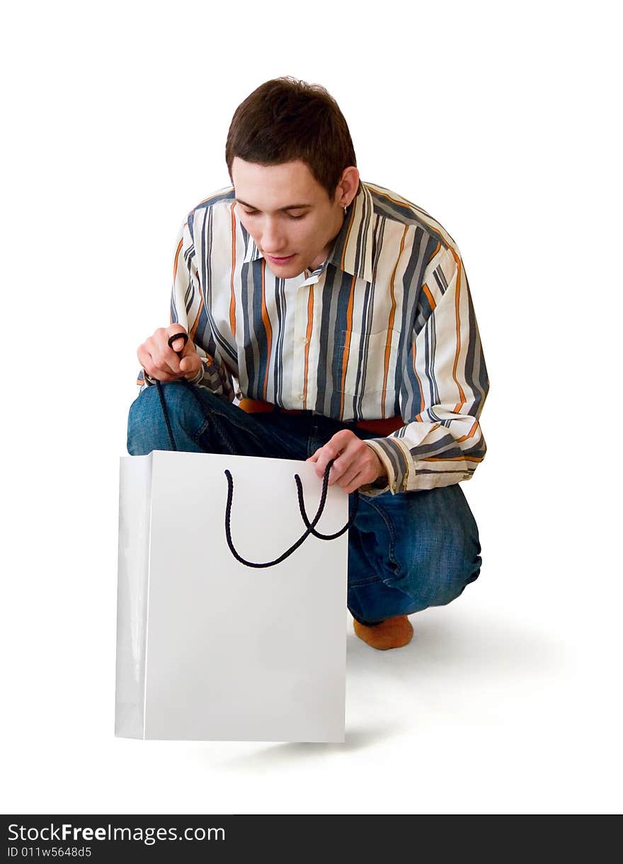 Man looks in gift package, on white background. Man looks in gift package, on white background