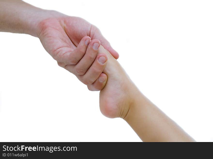 View of man’s hand holding baby’s toe on white background. View of man’s hand holding baby’s toe on white background