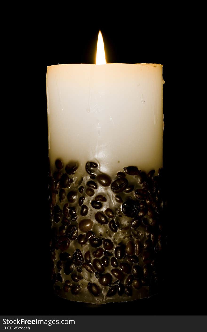 Candle isolated on black background