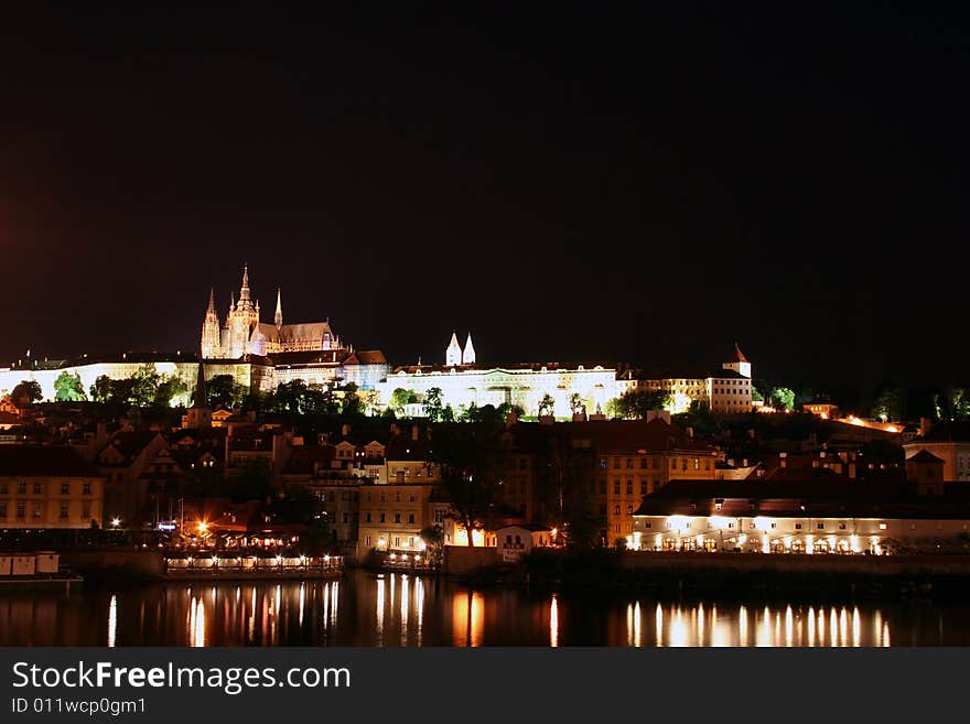 Beautiful night view at Prague, capital city of the Czech Republic with castle and roofs of Mala Strana