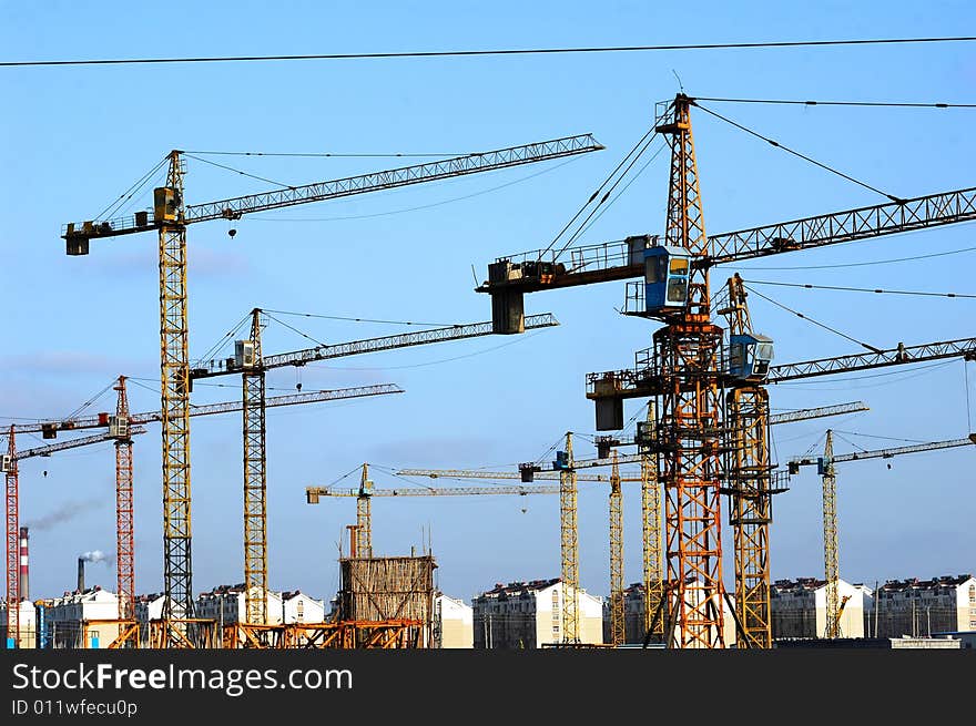 Construction cranes at building site