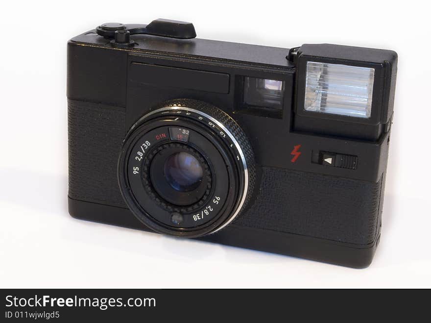 Old film camera isolated on a white background