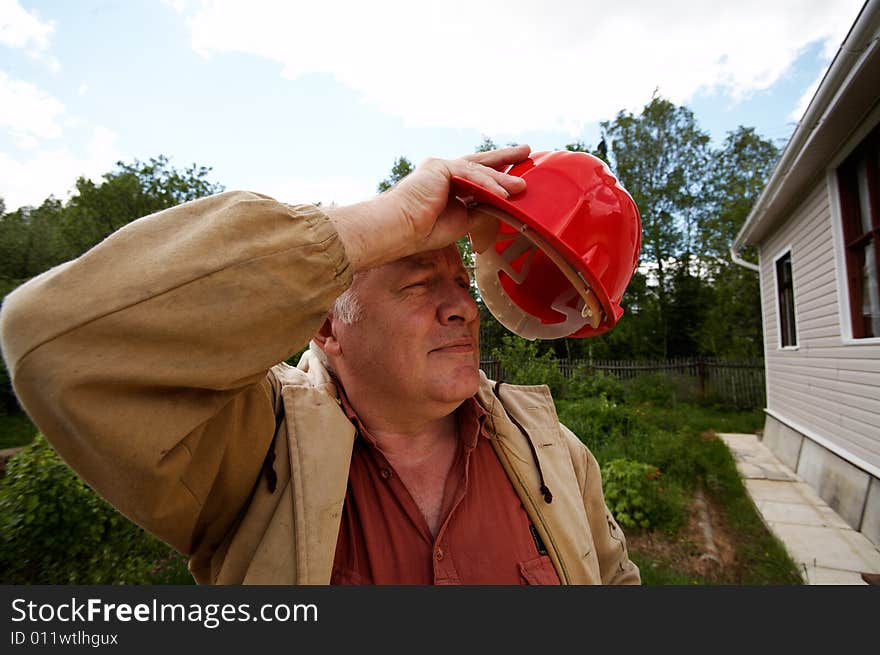 Smiling mature engineer with helmet. Smiling mature engineer with helmet