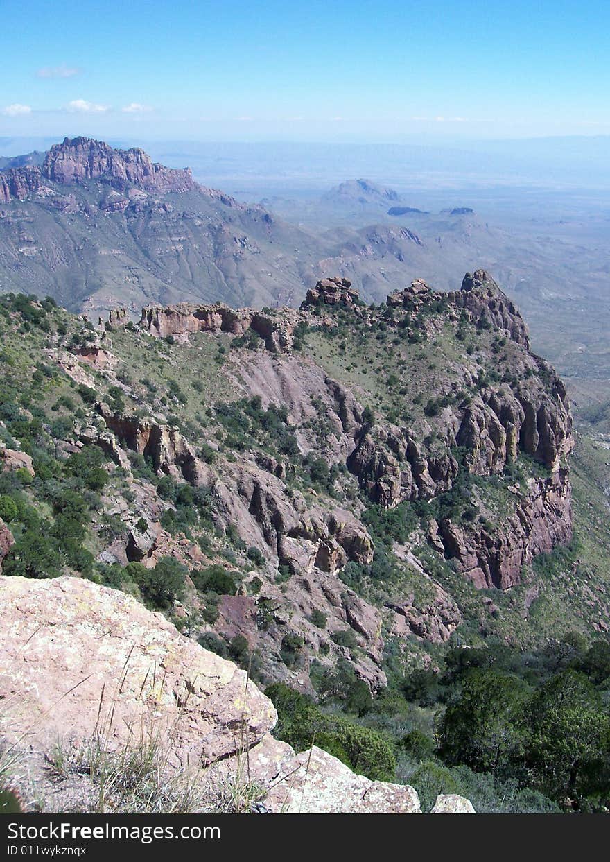 Desert mountain vista with cliffs and clouds