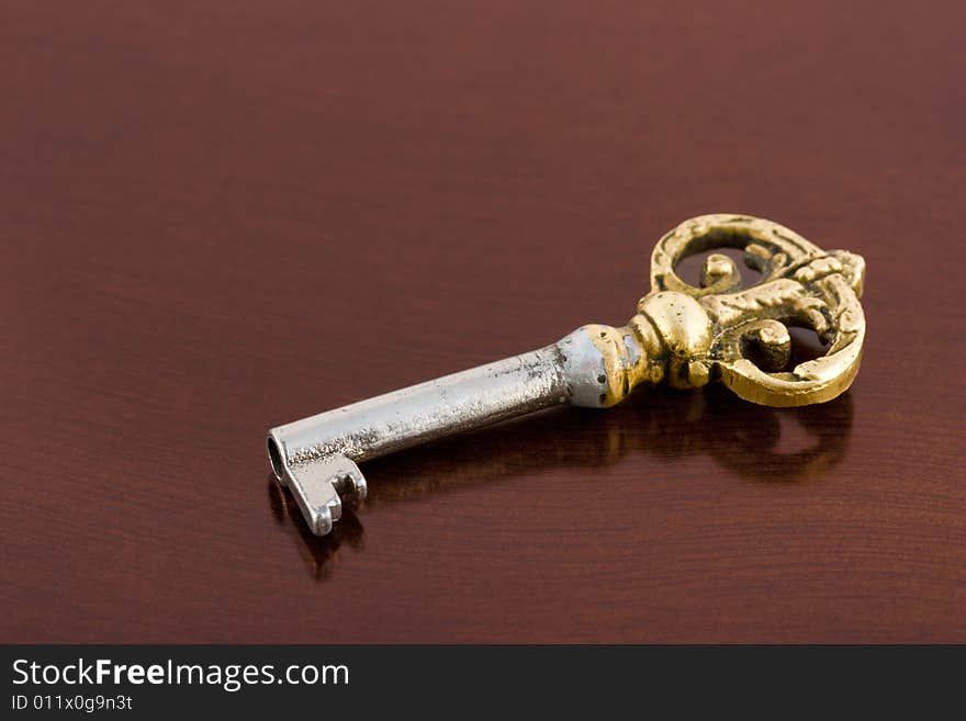 Retro key on wooden table