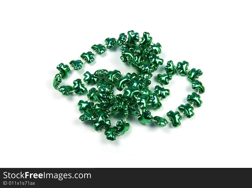 A photograph of clover beads against a white background. A photograph of clover beads against a white background