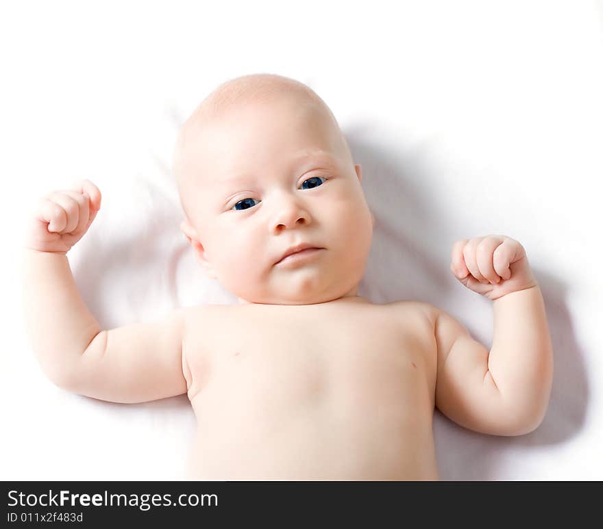 Looking serious cute baby boy with white background