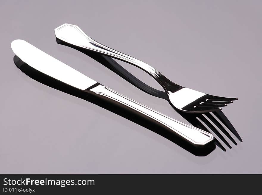 Cutlery in studio, dark background. Cutlery in studio, dark background