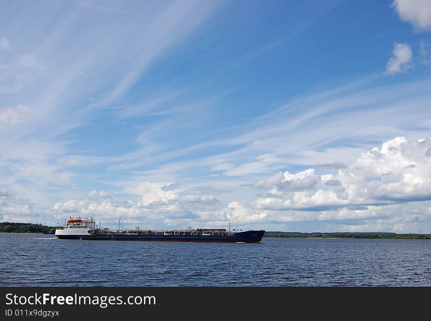 River cargo ship and blue sky