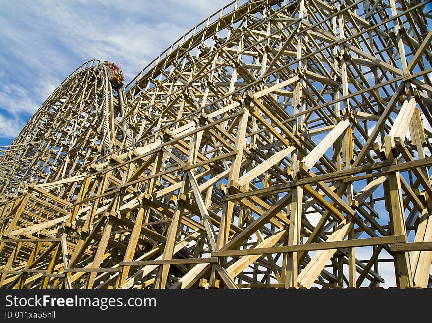 Photo of a wooden roller coaster in a theme park