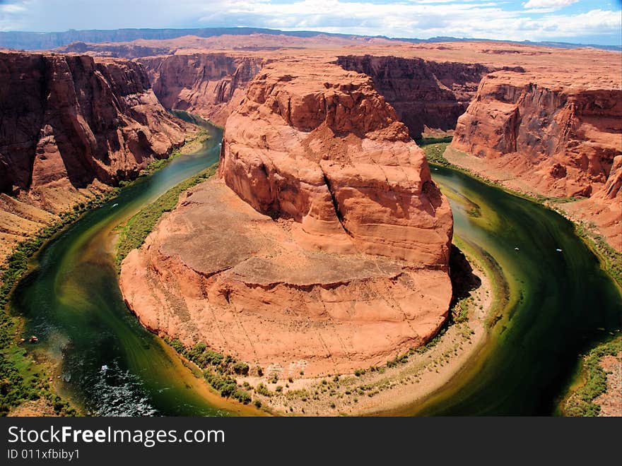 Horseshoe Bend landmark seen in Page Arizona where Colorado river bends around a hugh rock formation. Horseshoe Bend landmark seen in Page Arizona where Colorado river bends around a hugh rock formation