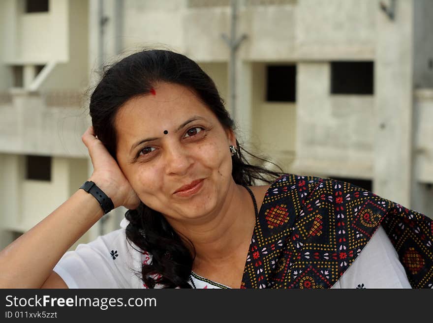 A modern Indian housewife in a fine and casual mood. A modern Indian housewife in a fine and casual mood.