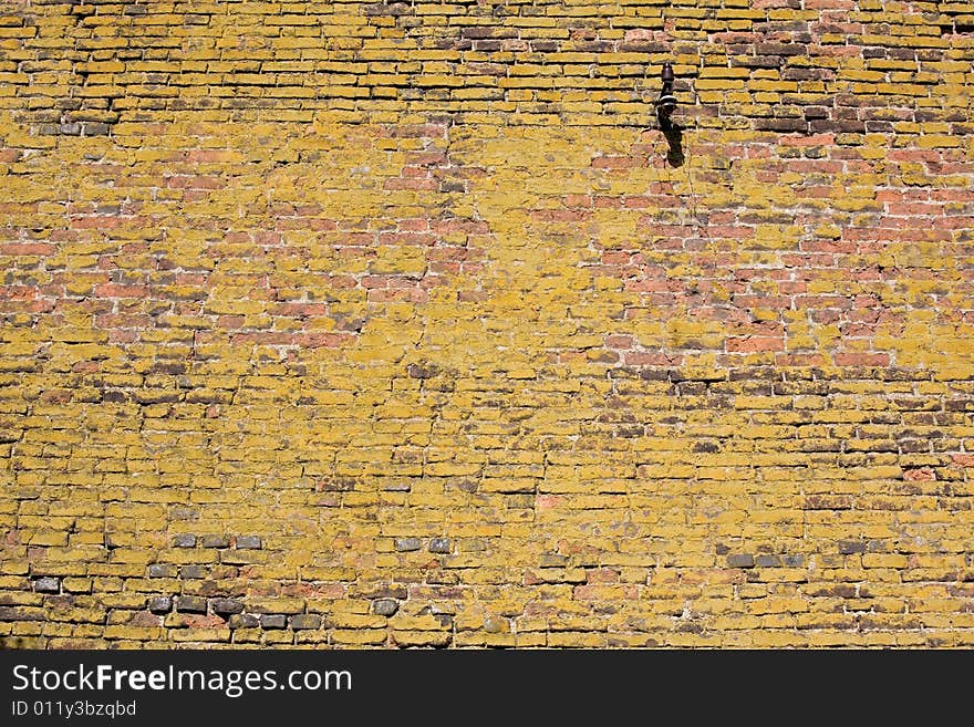 Structure of old mossy wall in Prague. Background texture.