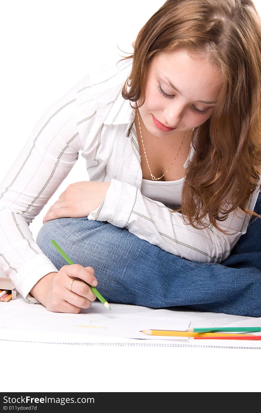 Beautiful girl is drawing with crayons. Isolated on white. #5. Beautiful girl is drawing with crayons. Isolated on white. #5