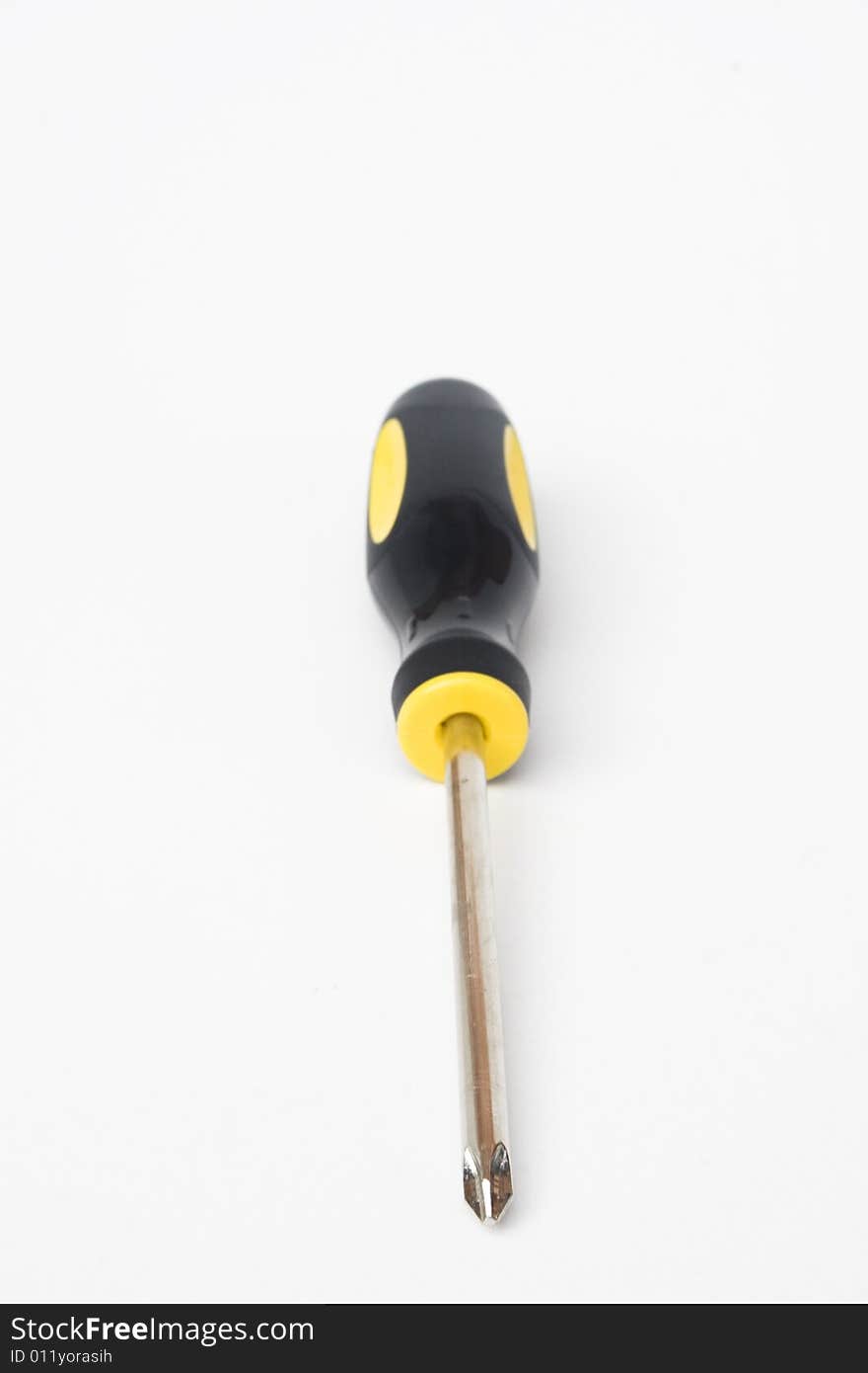 Yellow and black handled phillips screwdriver on white background. Yellow and black handled phillips screwdriver on white background