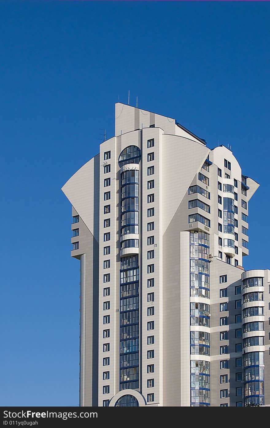 New modern multistory building on blue sky background