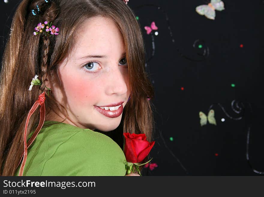 Teenage model with flowers and butterflies in her hair. Teenage model with flowers and butterflies in her hair