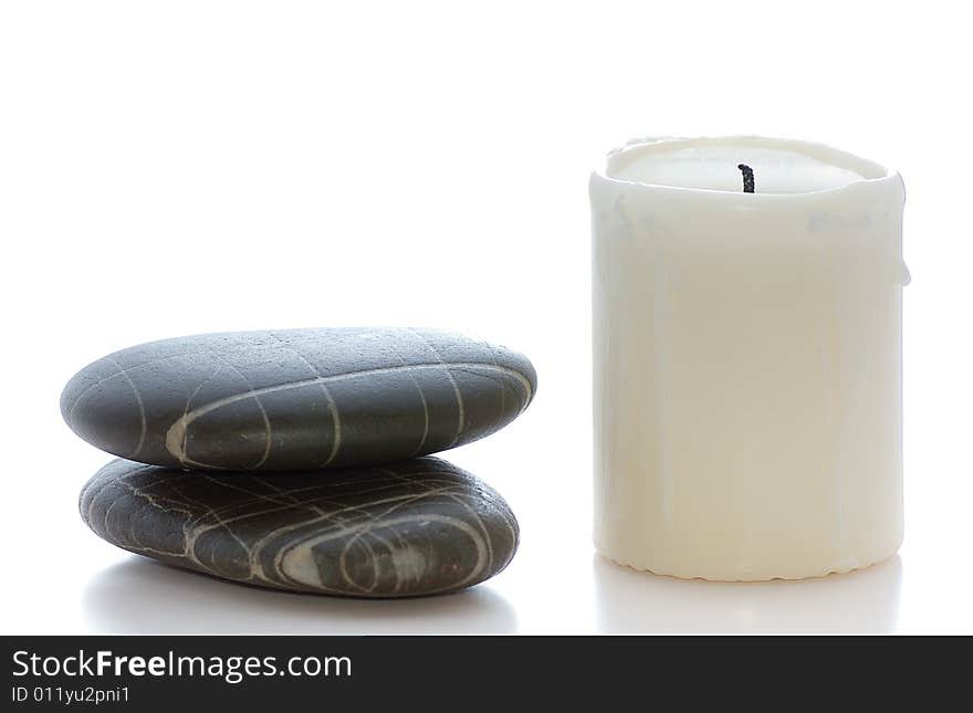 Spa stones with white candle. Spa stones with white candle