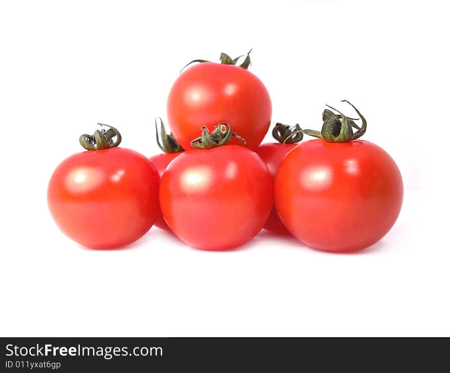 A few cherrytomatoes on a white background.