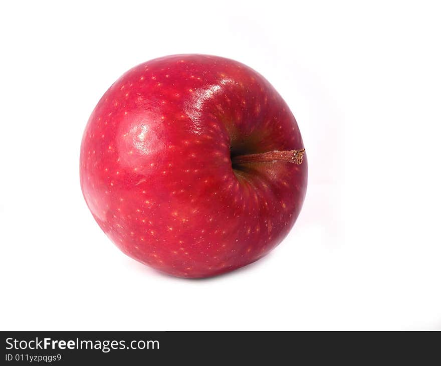 A red Jona gold apple on a white background. Foto taken from a 2/3 perspective. A red Jona gold apple on a white background. Foto taken from a 2/3 perspective.