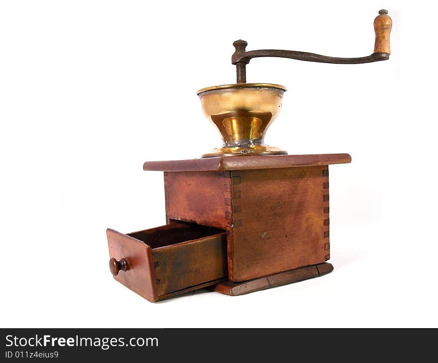 An old antique, wooden coffeemill. Shot taken from a 2/3 perfective on a white background. Use for grinding fresh coffeebeans