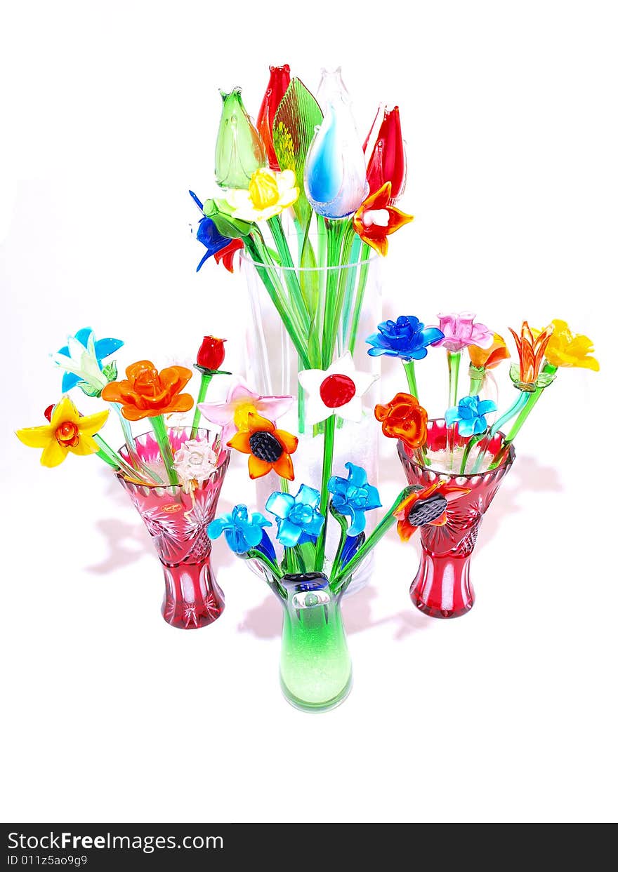 Grouped colorful crystal flowers in vases variety. Grouped colorful crystal flowers in vases variety