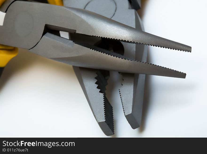 Modern and new metal flat-nose pliers close-up