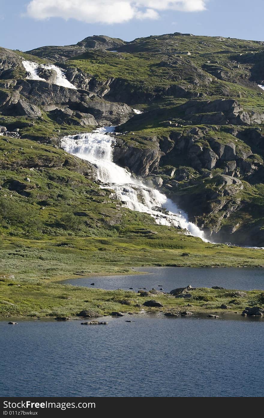 Waterfall In The Mountain