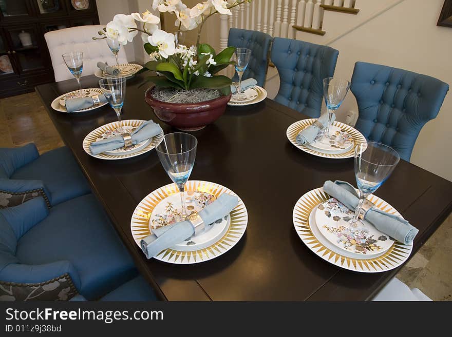 Dining table with modern tableware and decor. Dining table with modern tableware and decor.