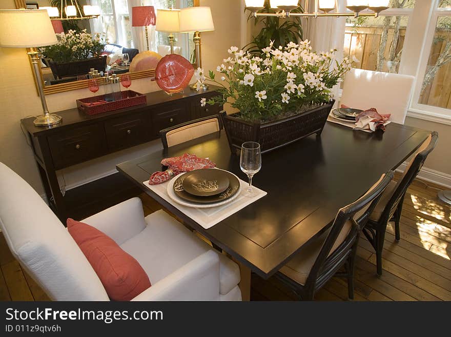 Dining room and table with modern decor. Dining room and table with modern decor.