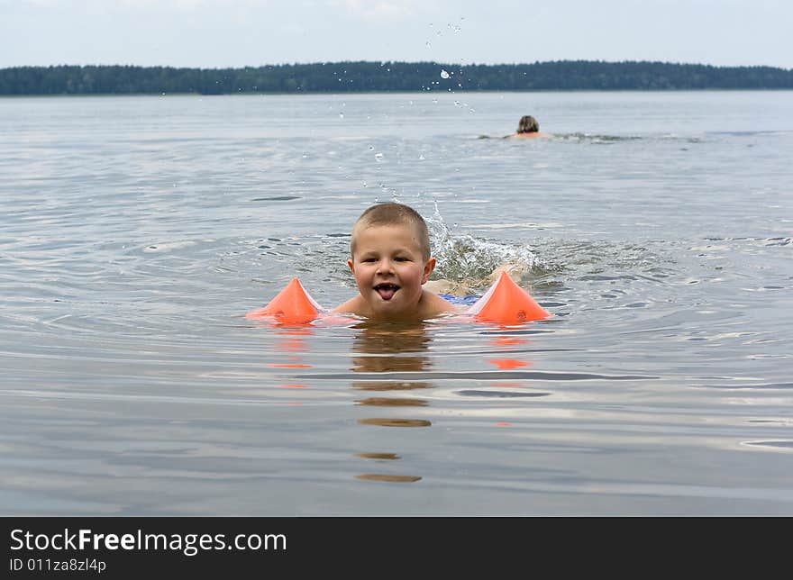 Small swimmer, color photo executed in poland