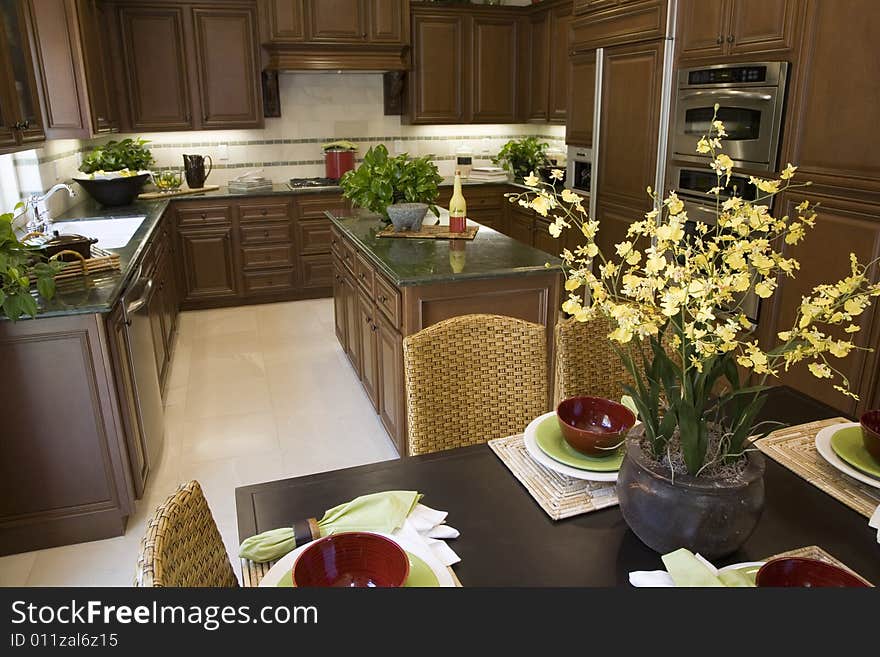 Decorated table with kitchen in the background. Decorated table with kitchen in the background.