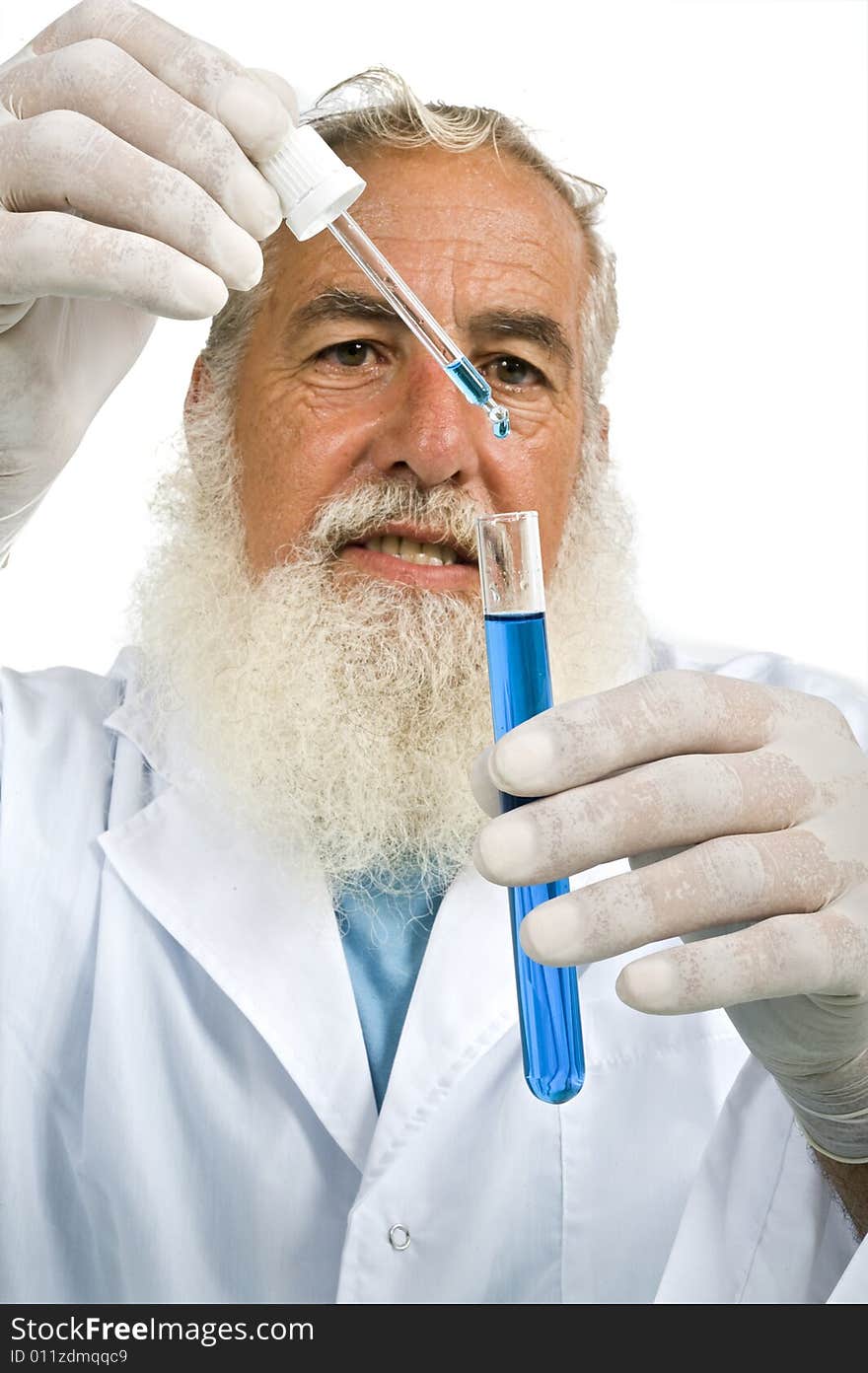 Mature scientist in laboratory holiding pipette and test tube with blue liquid isolated on white