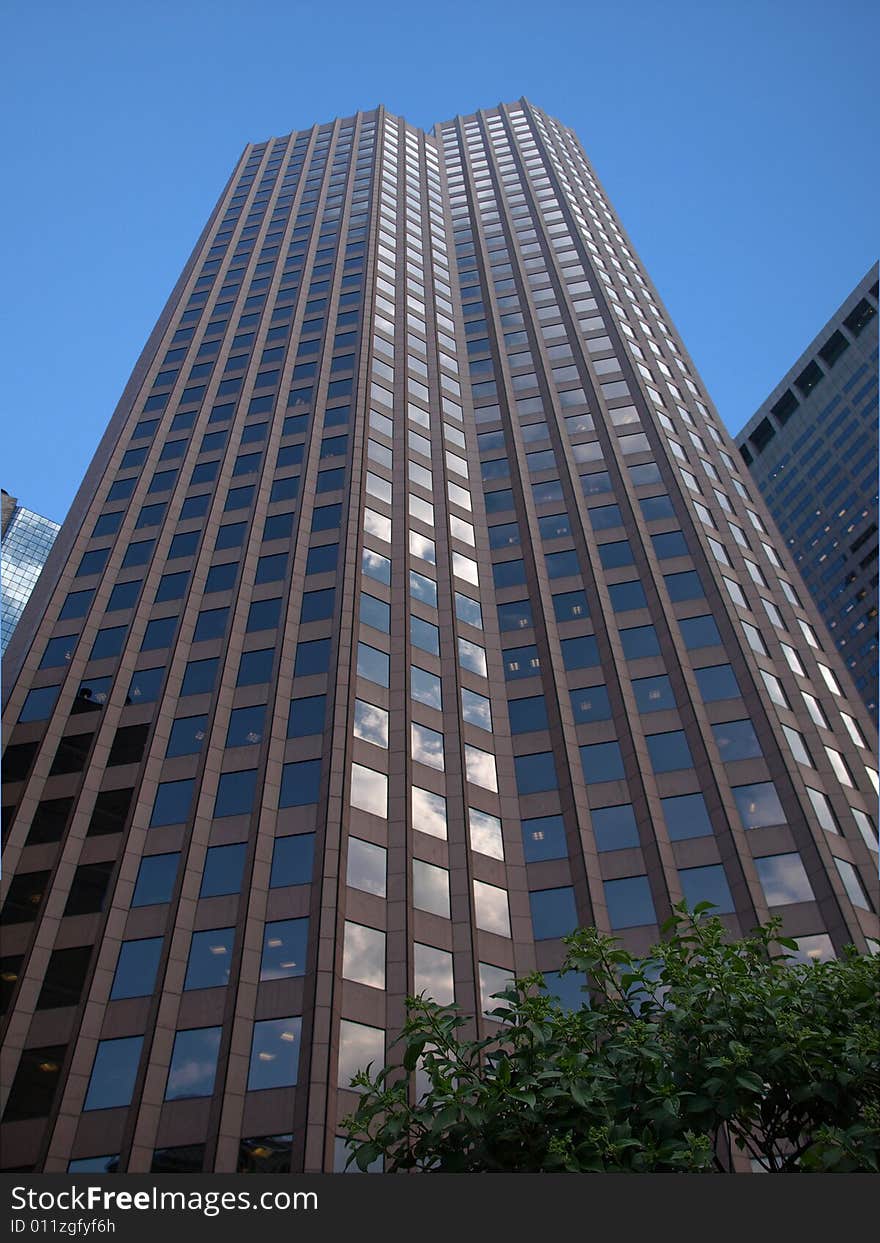 Glass Skyscraper Perspective view against blue sky