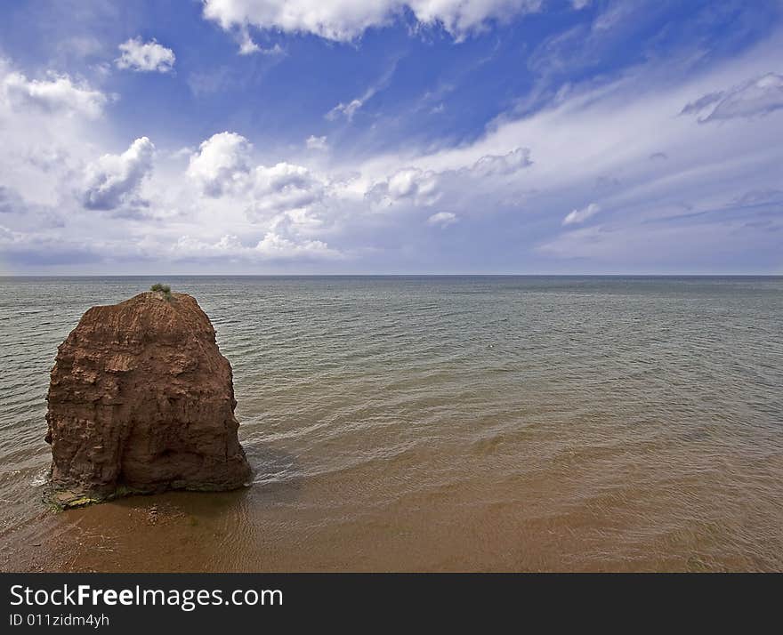 Sandstone pillar of rock on the North Shore of Prince Edward Island which is a typical formation for the island.