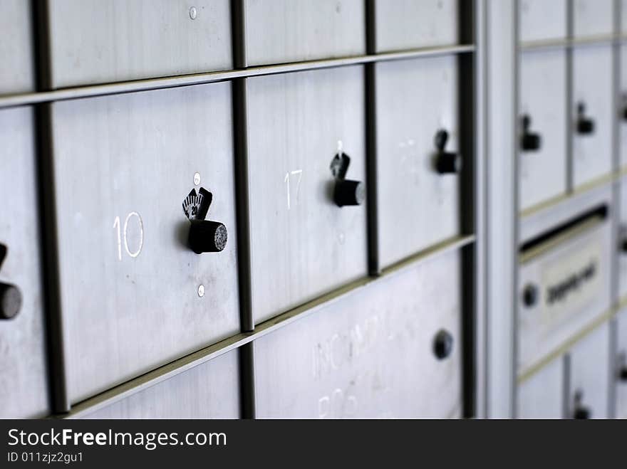 Rows of silver post boxes. Rows of silver post boxes.