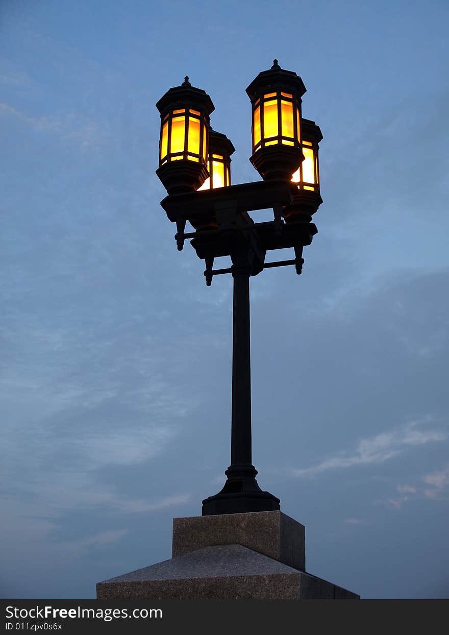 Four Yellow Lamp Streetlight against blue sky. Four Yellow Lamp Streetlight against blue sky