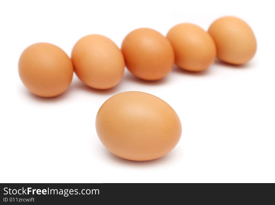 An egg isolated from the others over white background. An egg isolated from the others over white background.