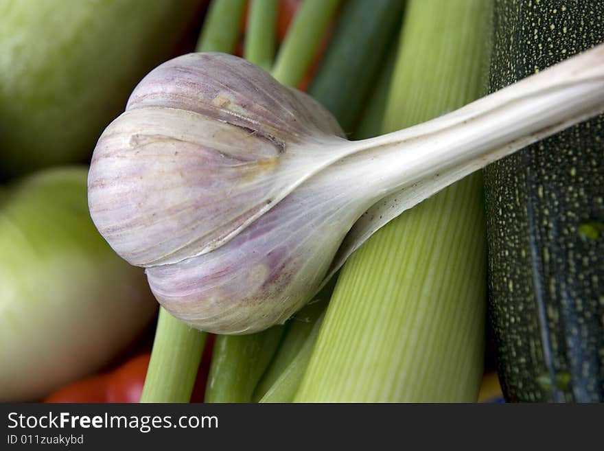 Fresh, tasty garlic on the green vegatables. Fresh, tasty garlic on the green vegatables