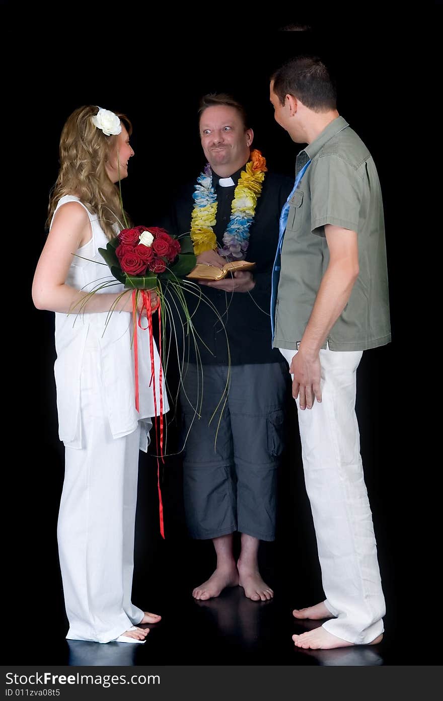 Young happy laughing wedding couple on black background, studio shot. Young happy laughing wedding couple on black background, studio shot