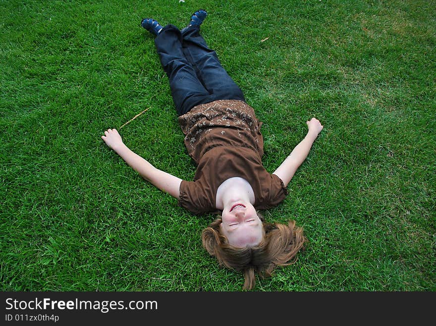 Girl Laying On Grass