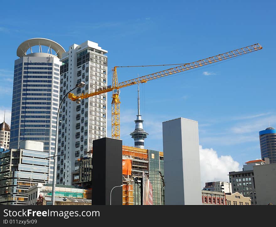 Construction crane with modern building background