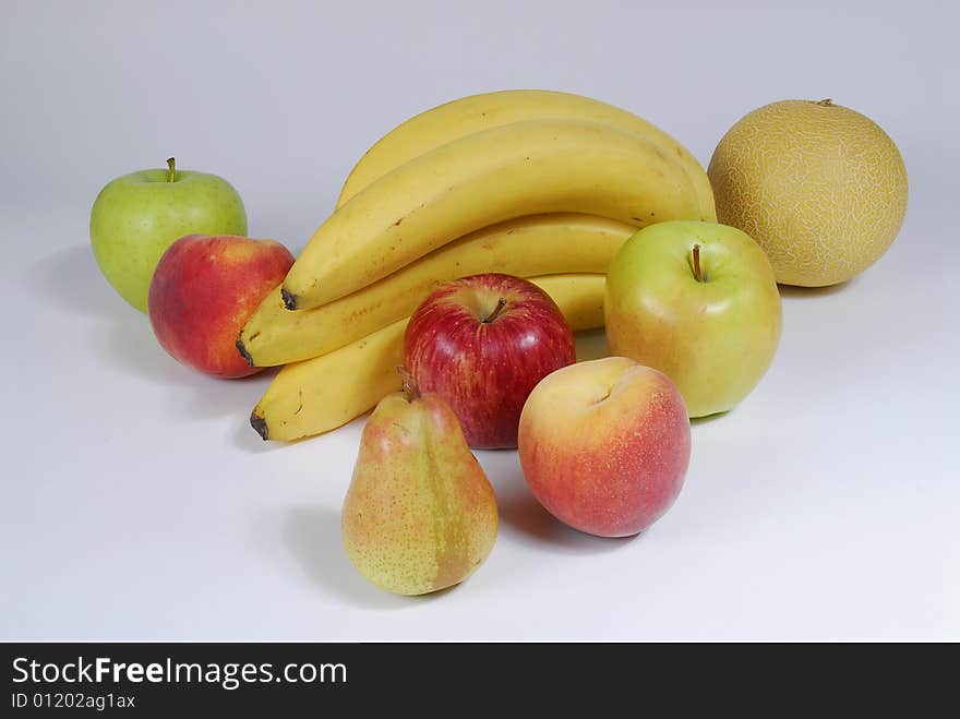 Beautiful natural fruit - bananas, meloa, peaches, pears,apples