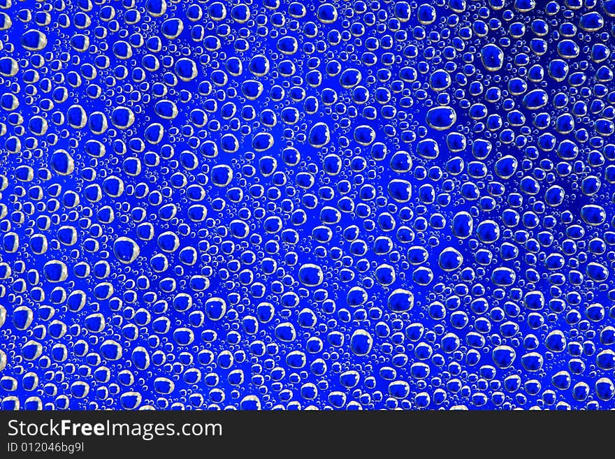 Drops of water on a blue background. Drops of water on a blue background.