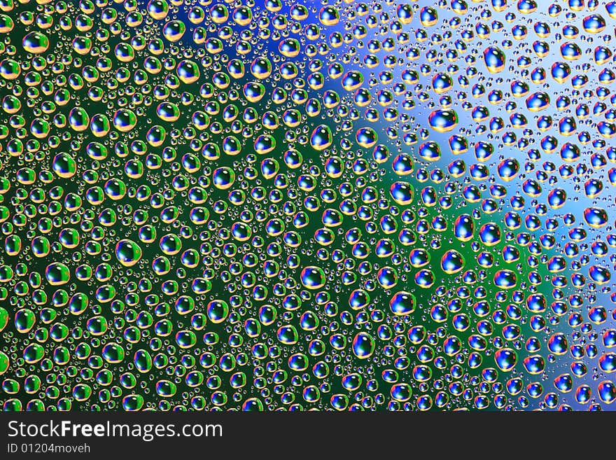 Drops of water on a blue, green background. Drops of water on a blue, green background.