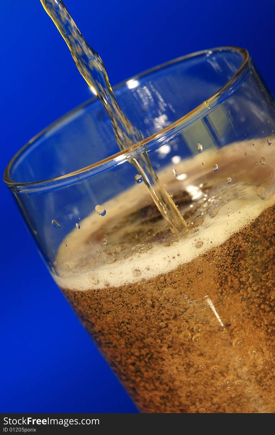 Glass of beer on blue background. Glass of beer on blue background.